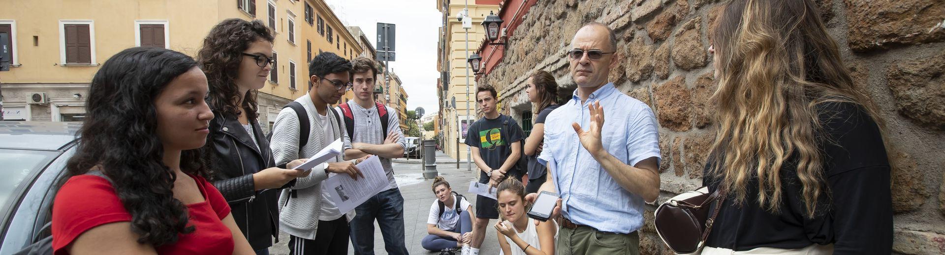 A Temple professor addresses students during a study away program in Rome.